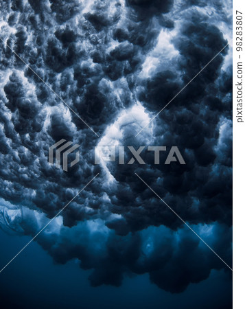 Ocean wave and foam underwater with clear water. Underwater clouds made by powerful wave Ocean wave and foam underwater with clear water. Underwater clouds made by powerful wave 98283807