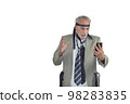 man in a suit and many ties on a white background looking angry at the mobile 98283835