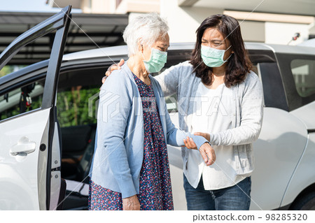 Caregiver help and support asian senior or elderly old lady woman patient walk with walker prepare get to her car, healthy strong medical concept. Caregiver help and support asian senior or elderly old lady woman patient walk with walker prepare get to her car, healthy strong medical concept. 98285320