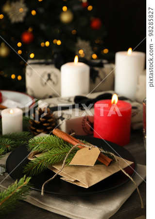 Concept of Happy New Year, beautiful and cozy table setting Concept of Happy New Year, beautiful and cozy table setting 98285827