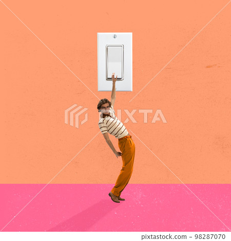 Young man presses a huge switch button. Contemporary art collage. Retro, vintage style. Minimalism. Old-fashioned and modern technology. Young man presses a huge switch button. Contemporary art collage. Retro, vintage style. Minimalism. Old-fashioned and modern technology. 98287070
