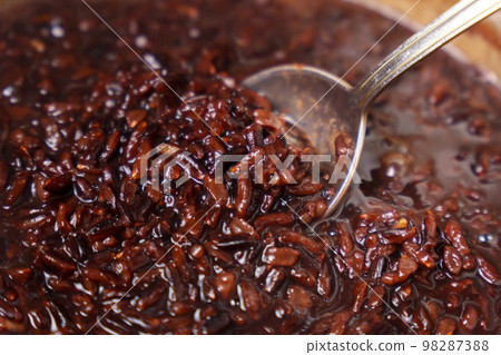 Organic grain brown rice cooking close-up. Selective focus. Organic grain brown rice cooking close-up. Selective focus. 98287388