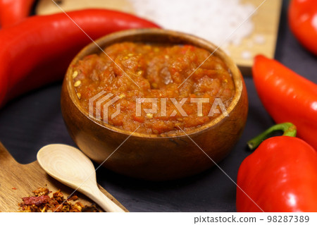 Balkan sauce ajvar and ingredients for its preparation. Serbian traditional food. 98287389