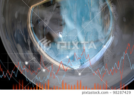 Industrial washing machine are spinning. Chart of the laundry machine, close-up. Selective focus 98287429