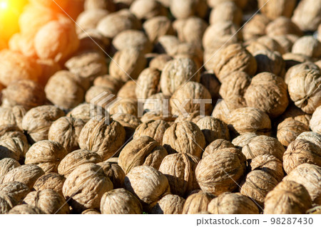 Background of fresh walnuts, vegetable protein for vegetarianism and raw food. Concept is healthy eating. 98287430