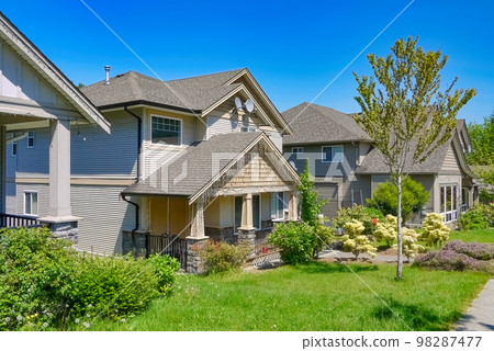 North American residential houses on the street with blue sky background 98287477