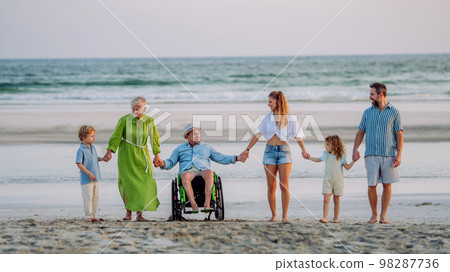 Portrait of three geneartions family with little kids enjoying time at sea in exotic country. Portrait of three geneartions family with little kids enjoying time at sea in exotic country. 98287736