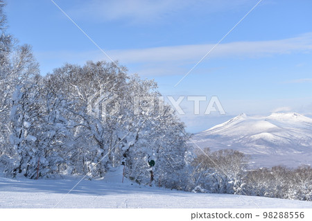 Shoot the snowy scenery of Mt. Komagatake from the ski resort in Nanae, Hokkaido in winter 98288556