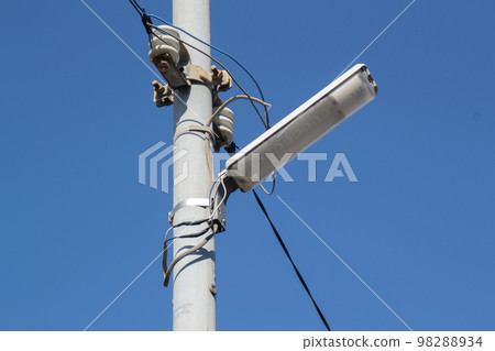 Street lights attached to utility poles Security lights 98288934