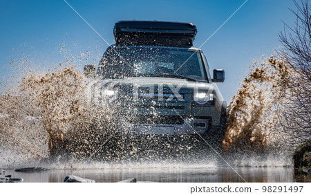 Off road tourist car rides off-road in the highlands. Expedition travel and vacation, adventures in remote areas. Off road tourist car rides off-road in the highlands. Expedition travel and vacation, adventures in remote areas. 98291497