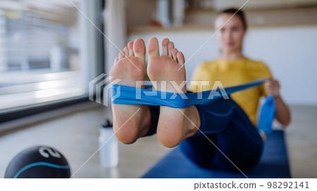 Young woman doing an exercises at home. 98292141