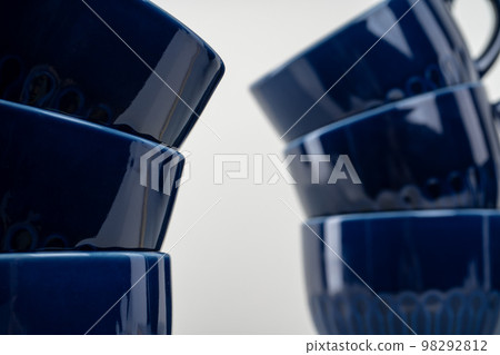 Simple ceramic blue crockery on kitchen counter 98292812