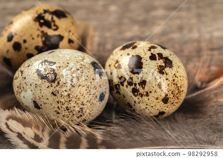 Quail eggs on a wooden table 98292958