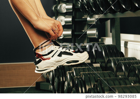 Cropped image of a woman training in a gym 98293085