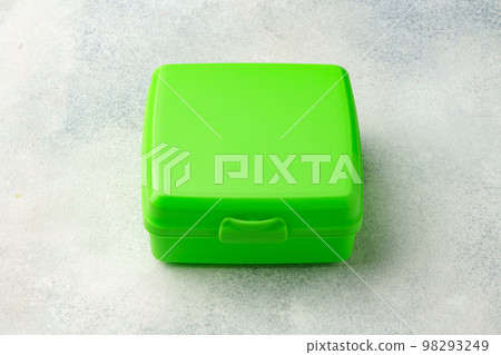 New plastic lunch box on a gray background New plastic lunch box on a gray background 98293249