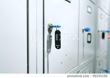 Gray locker with key for safety in public facility 98293280
