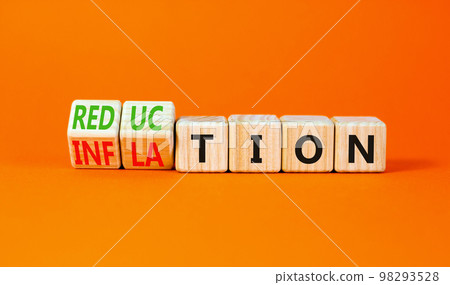 Inflation or reduction symbol. Concept word Inflation Reduction on wooden cubes. Beautiful orange table orange background. Business inflation or reduction concept. Copy space. 98293528