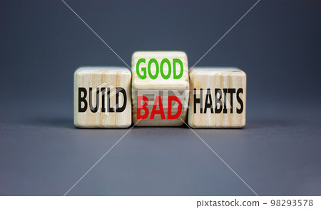 Build good or bad habits symbol. Concept word Build good or bad habits on wooden cubes. Beautiful grey table grey background. Business and build good or bad habits concept. Copy space. 98293578