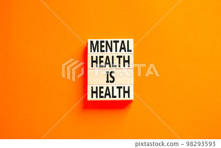 Mental health psychological symbol. Concept words Mental health is health on wooden blocks on a beautiful orange table orange background. Psychological mental health concept. 98293593
