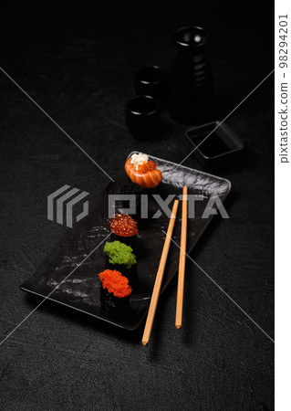 Gunkan Sushi on a Black Background. Menu Stock Photo - Image of