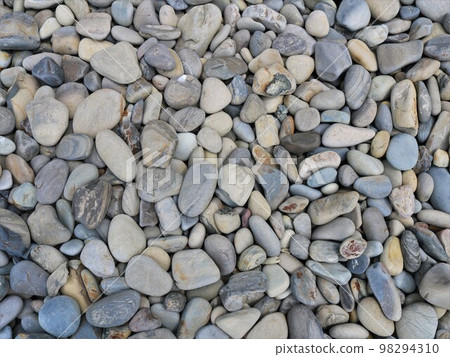 graphic resource of rounded sea stones in gray and brown shades with a beautiful texture full frame, building mineral material of round river cobblestones scattered on a flat surface graphic resource of rounded sea stones in gray and brown shades with a beautiful texture full frame, building mineral material of round river cobblestones scattered on a flat surface 98294310