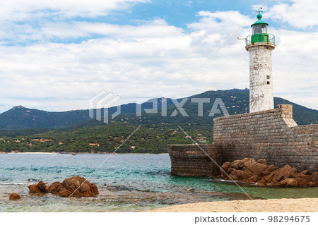 White lighthouse tower at the entrance to Propriano port, Corsica 98294675