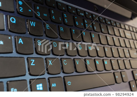 Closeup shot of black computer keyboard. Work at home concept Closeup shot of black computer keyboard. Work at home concept 98294924