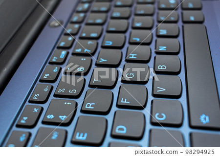 Closeup shot of black computer keyboard. Work at home concept Closeup shot of black computer keyboard. Work at home concept 98294925