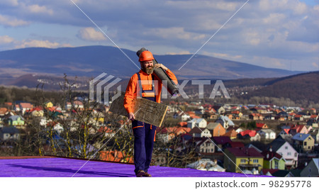 Removing hazards. Inspect repair and replace. Fix or build. Provide safe access to roof. Roofer repair roof. Roof installation. Man hard hat work outdoor. Building house. Roof Mechanic concept 98295778