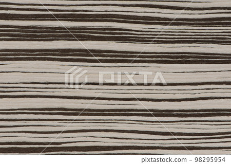 Texture of natural wood with horizontal black and white stripes. Zebra wood texture close up. High quality wooden background 98295954