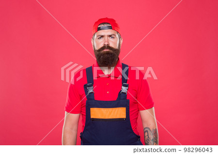 Real man. Handyman service. Man helpful laborer. Repair and renovation. Guy brutal bearded worker in uniform. Builder regular worker. Handyman services concept. Handyman professional occupation Real man. Handyman service. Man helpful laborer. Repair and renovation. Guy brutal bearded worker in uniform. Builder regular worker. Handyman services concept. Handyman professional occupation 98296043