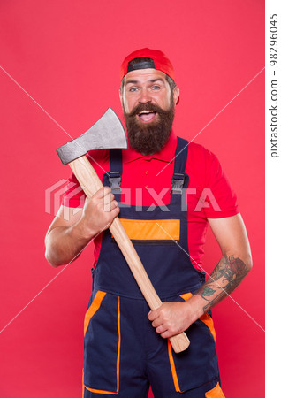 Brave worker. Cutting beard. Brutality and masculinity. Bearded lumberjack. Man builder uniform hold axe. Bearded man hold ax red background. Danger concept. Renovation concept. Bearded handyman 98296045