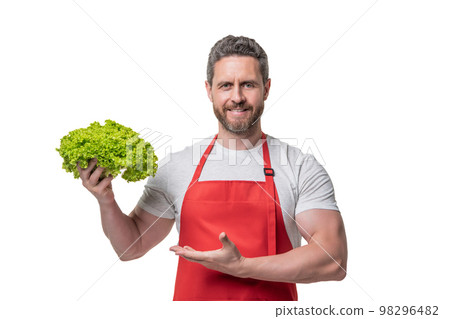 man in apron presenting lettuce vegetable isolated on white 98296482