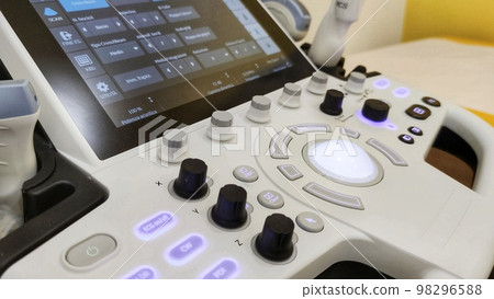 Various transducers on the sonography machine. Close up. System control panel of modern ultrasound equipment at backdrop in blur 98296588