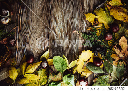 Autumn wooden background with maple leaves with copy space Autumn wooden background with maple leaves with copy space 98296862