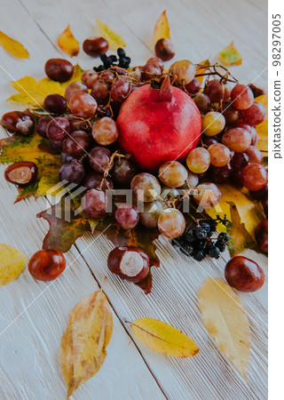 Autumn still life. apple, pumpkin, pomegranate, viburnum, leaves. Flatlay background 98297005