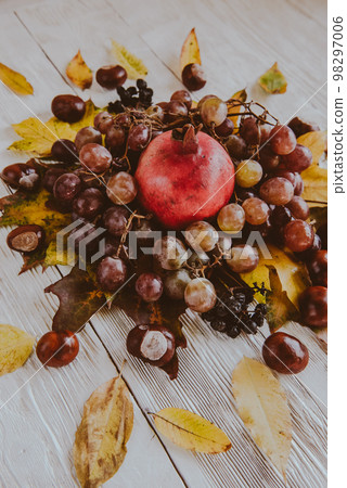 Autumn still life. apple, pumpkin, pomegranate, viburnum, leaves. Flatlay background 98297006