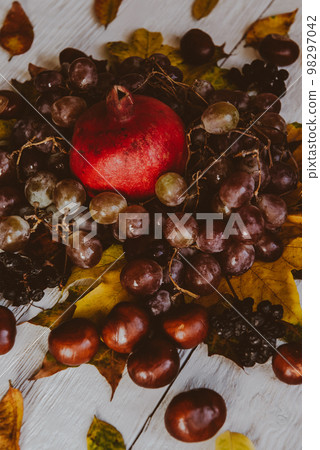 Autumn still life. apple, pumpkin, pomegranate, viburnum, leaves. Flatlay background 98297042