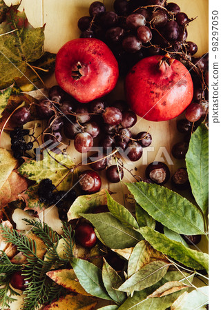 Autumn still life. apple, pumpkin, pomegranate, viburnum, leaves. Flatlay background 98297050