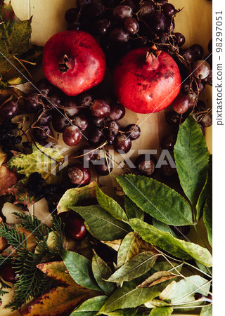 Autumn still life. apple, pumpkin, pomegranate, viburnum, leaves. Flatlay background 98297051