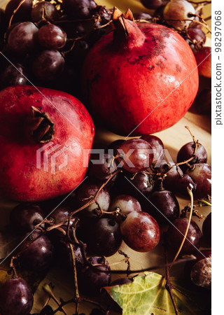 Autumn still life. apple, pumpkin, pomegranate, viburnum, leaves. Flatlay background Autumn still life. apple, pumpkin, pomegranate, viburnum, leaves. Flatlay background 98297068