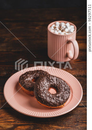 Two Chocolate Donuts and Mug of Hot Chocolate with Marshmallow 98297511