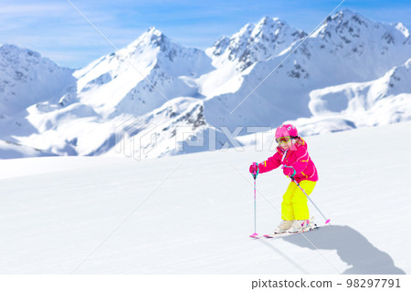 Ski and snow fun. Child in winter mountains. 98297791