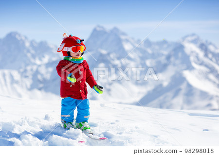 Kids winter snow sport. Children ski. Family skiing. 98298018