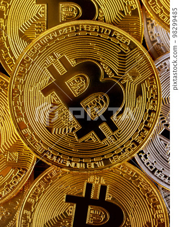 Many golden bitcoins. Cryptocurrency and virtual money concept 98299485