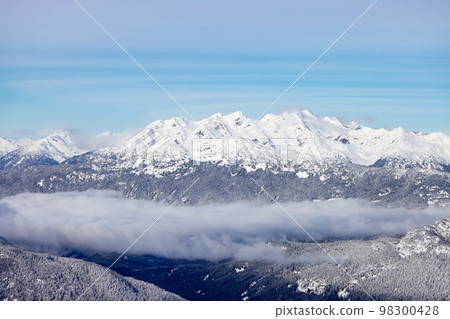 Snow and Cloud covered Canadian Nature Landscape Background. Winter Season in Whistler 98300428
