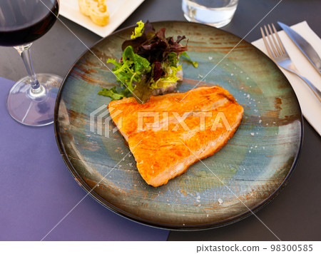 Roasted salmon with a light vegetable salad 98300585