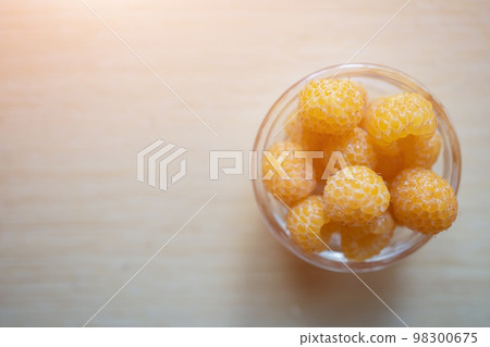 fresh healthy raspberry in glass plate on wooden background fresh healthy raspberry in glass plate on wooden background 98300675