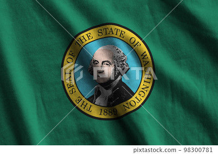 Washington US state flag with big folds waving close up under the studio light indoors. The official symbols and colors in banner 98300781
