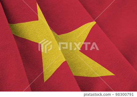 Vietnam flag with big folds waving close up under the studio light indoors. The official symbols and colors in banner 98300791